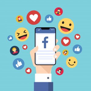 Kreslené logo Facebooku na mobilním telefonu